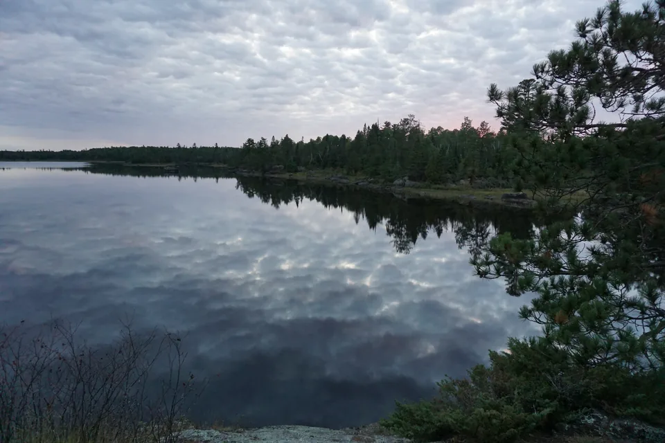 A quiet Boundary Waters lake at approaching sunset.
